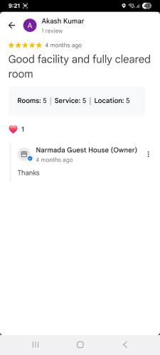 a screenshot of a cell phone with the words good facility and fully cleared at Narmada Guest House in Indore