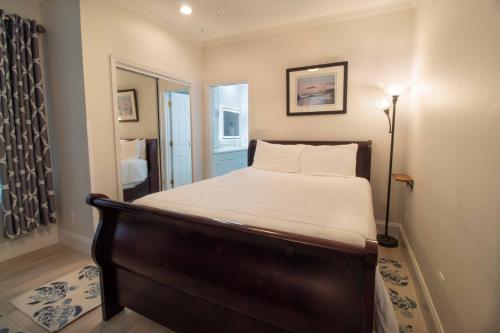a bedroom with a bed in a room at Pier Pleasure in Folly Beach