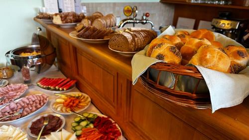 a buffet of bread and pastries on a table at Penzion SATELIT in Deštné v Orlických horách