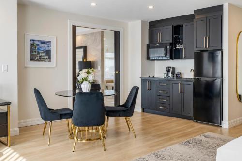 a kitchen and dining room with a table and chairs at Halifax Tower Hotel & Conference Centre, an Ascend Collection Hotel in Halifax