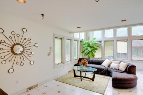 a living room with a couch and a table at Pool Table and Deck Luxury Mansion in Niskayuna! in Niskayuna
