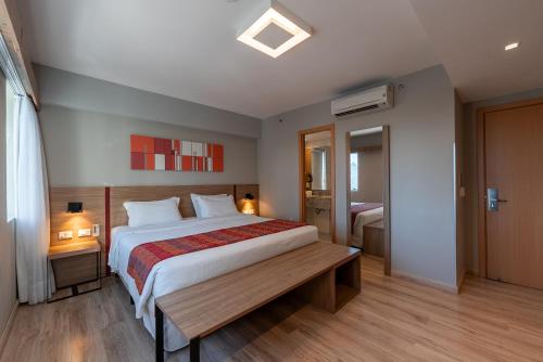 Cama o camas de una habitación en Hotel Laghetto Stilo Higienópolis