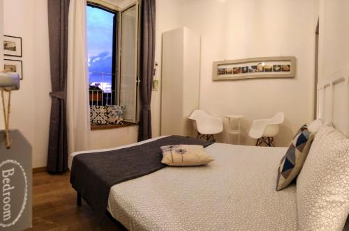 a hotel room with a bed and a window at Casa nel quartiere medioevale di Tivoli in Tivoli
