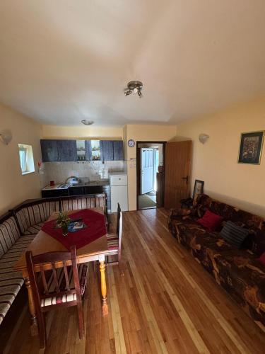 a living room with a couch and a table at Villa Vera in Vrnjačka Banja