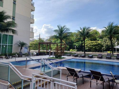 Bazén v ubytování Suíte Confortável no Rio2 - Barra Olímpica RJ nebo v jeho okolí