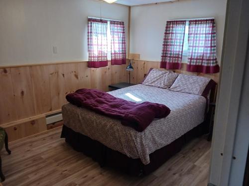 Katil atau katil-katil dalam bilik di Beachfront Vacation Cottages