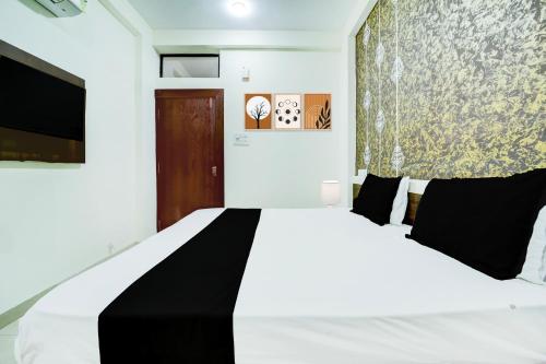 Super Collection O Hotel SP14にあるベッド