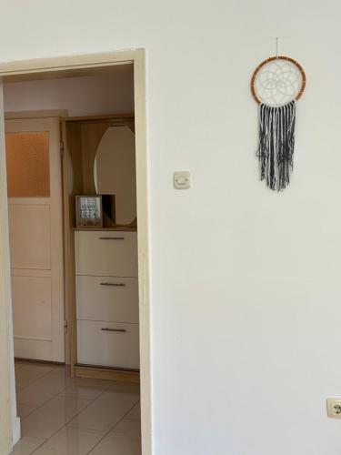a hallway with a door leading into a room with a mirror at LivStay in Livno