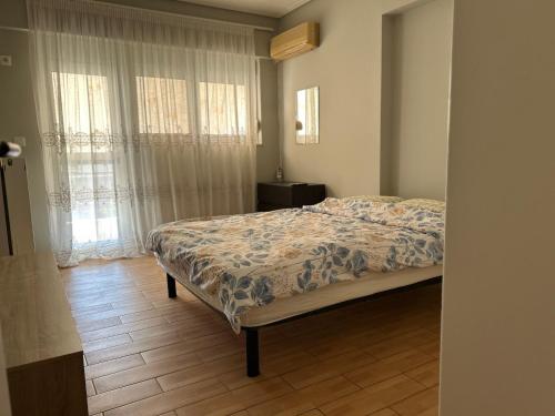 Ένα ή περισσότερα κρεβάτια σε δωμάτιο στο Athens Cozy Apartment