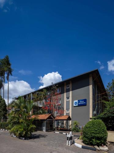 a building with a sign on the side of it at Best Western Nairobi Upper Hill in Nairobi