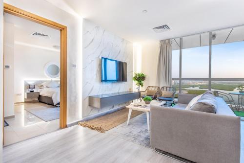 a living room with a couch and a large mirror at Live in the center of Mountains, Sea, Mangroves in Ras al Khaimah