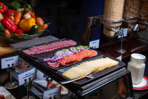 a buffet of food with meats and cheese and fruit at Best Western Nairobi Upper Hill in Nairobi