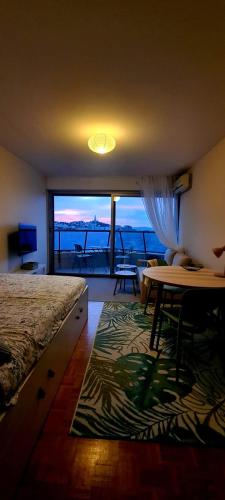 a bedroom with a bed and a view of the ocean at Incroyable Vue mer et Notre Dame in Marseille
