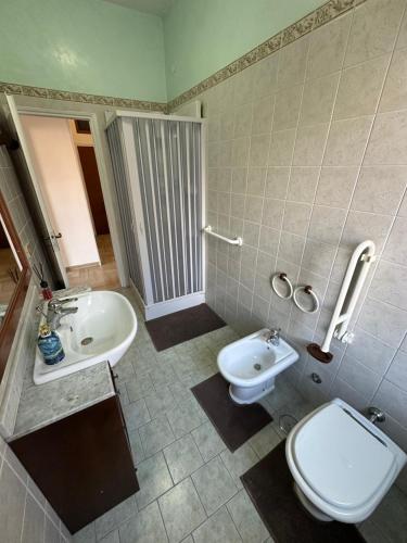 a bathroom with a toilet and a sink at La casa di Anna in Lamezia Terme
