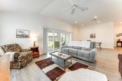 a living room with a couch and a table at New Designer Home in The Villages Shady Brook in Wildwood