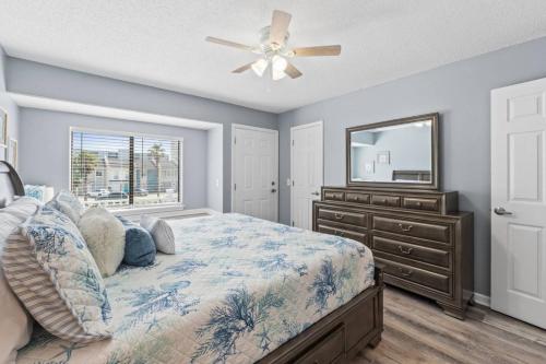 En eller flere senge i et værelse på Salty Blue Paradise PCB