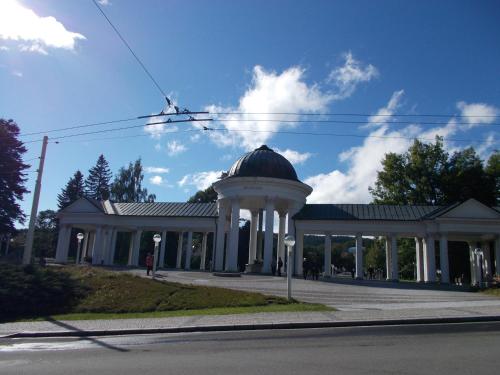 a building with a gazebo on a street at Villa Meteor in Mariánské Lázně