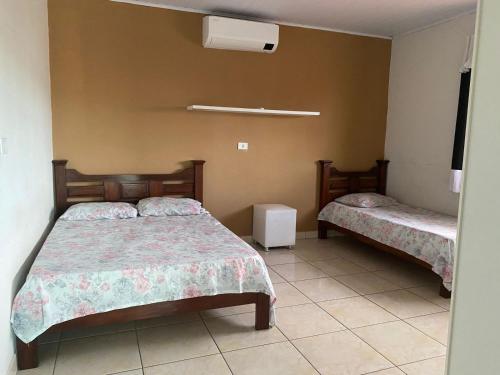 a bedroom with two beds in a room at Casa em Marechal Deodoro in Marechal Deodoro