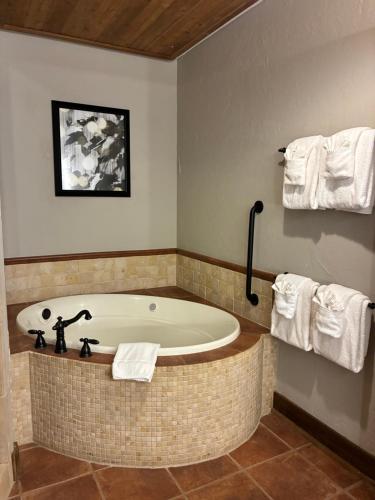 a bath tub in a bathroom with towels at Stonewater Cove in Shell Knob