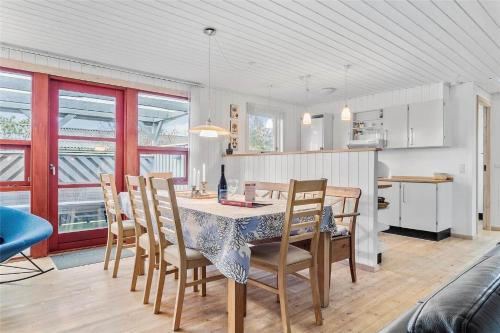 a kitchen and dining room with a table and chairs at 136-Snedsted-Lykkens-Hab-23 in Snedsted