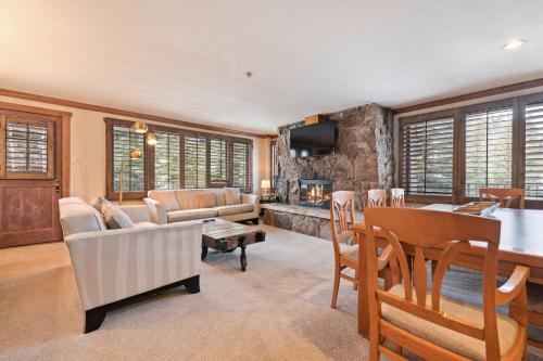 a living room with a couch and a table at Lodge Tower 299 One Bedroom Residence in Vail