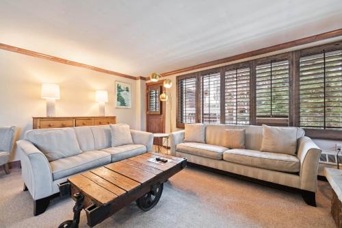 a living room with two couches and a coffee table at Lodge Tower 299 One Bedroom Residence in Vail
