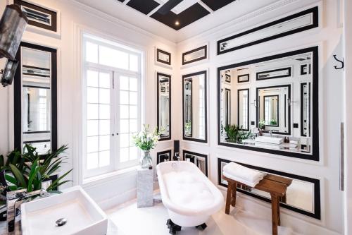a bathroom with a white toilet and a sink at La Valise Mexico City, member of Small Luxury Hotels in Mexico City
