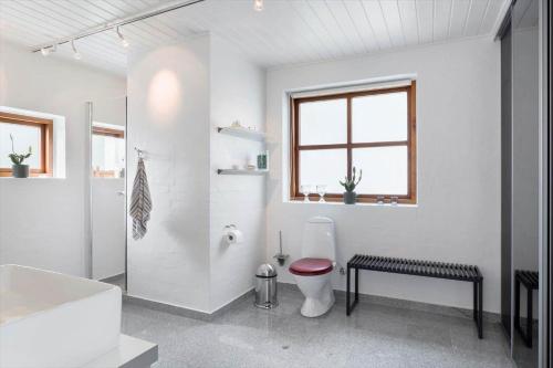a white bathroom with a toilet and a sink at 496-Snedsted-Niels-Juels-Vej-33 in Snedsted