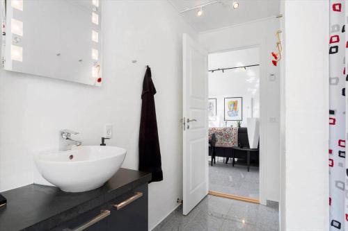 a bathroom with a white sink and a black counter at 496-Snedsted-Niels-Juels-Vej-33 in Snedsted