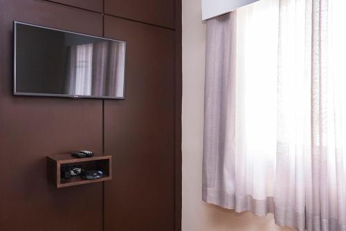 Hotel Marborにあるテレビまたはエンターテインメントセンター