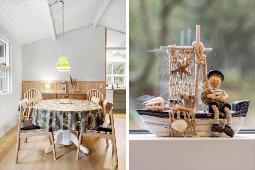 a dining room with a table and a toy boat at 873-Thisted-Blamunkevej-67 in Thisted