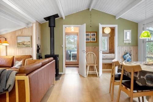 a living room with a couch and a stove in it at 873-Thisted-Blamunkevej-67 in Thisted