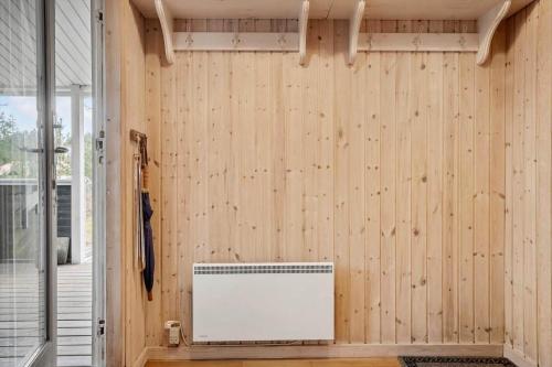 a room with a wooden wall with a radiator at 873-Thisted-Blamunkevej-67 in Thisted