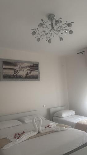 a room with two beds and a picture on the wall at Casa Gena in Favaro Veneto