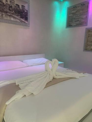 a bedroom with a bed with a towel on it at Casa Gena in Favaro Veneto