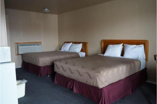 Postel nebo postele na pokoji v ubytování Juniper Motel Madras by Townhouse