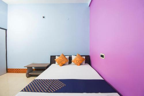 Postel nebo postele na pokoji v ubytování Hotel O Aagman Guest House