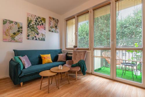 a living room with a couch and a table at Apartament HoliStay in Oświęcim