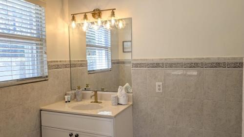 a bathroom with a sink and a mirror at Bimini Tides in South Bimini