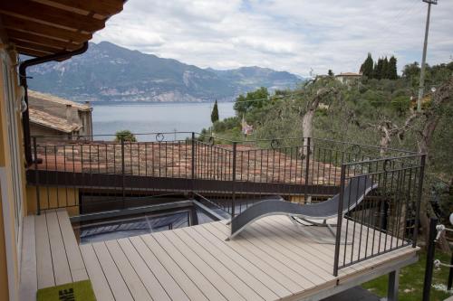 a balcony of a house with a view of a lake at Locanda San Marco in Torri del Benaco