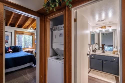 a bathroom with a sink and a washing machine in a room at NorthShore # 47 By Hauserman Rentals in Tahoe City