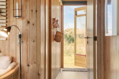 a hallway with a door to a room with a window at 1024-Thisted-Lars-Badskjaers-Sti-2 in Torsted