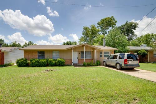 a house with a car parked in a driveway at Pet-Friendly Sachse Home Large Fenced Yard in Sachse