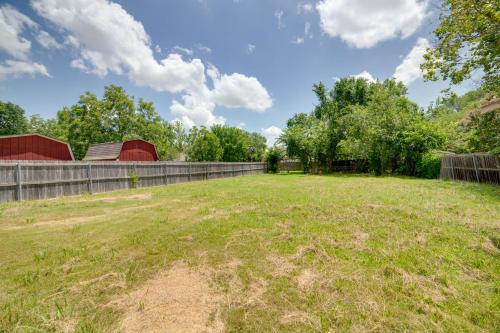 an open field with a fence and trees at Pet-Friendly Sachse Home Large Fenced Yard in Sachse