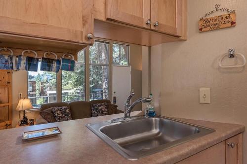 a kitchen with a stainless steel sink in a kitchen at Dollar Hill II # 49 By Hauserman Rentals in Tahoe City
