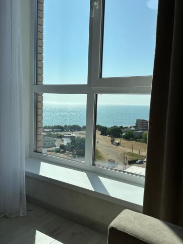 a window in a room with a view of the ocean at Студия с Видом на Море, 9-2 in Chornomorsk