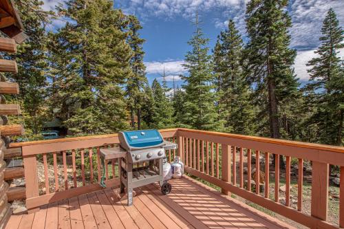 a grill on the deck of a house at Little Bear Cabin By Hauserman Rentals in Tahoe Vista