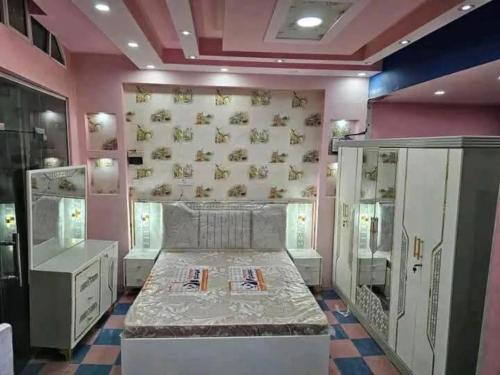 a room with a bed in the middle of a room at Tea apartment in Aqaba