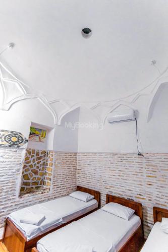 Letto o letti in una camera di Ohun karavan saray historical 18th century hotel