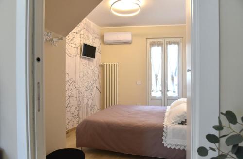 Postel nebo postele na pokoji v ubytování Maison Del Borgo
